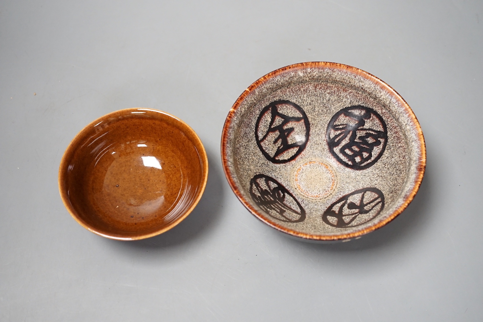 A Chinese brown glazed bowl and a Jian type papercut bowl (2)